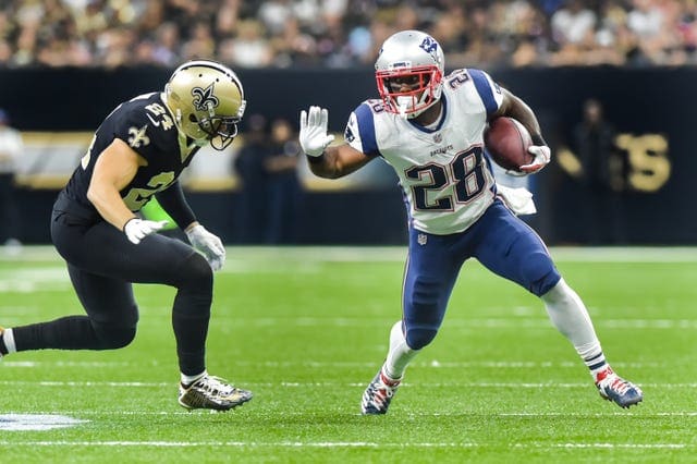 New England Patriots running back James White (28) runs the ball against the New Orleans Saints. Mandatory Credit: Scott Clause/The Advertiser via USA TODAY Sports
